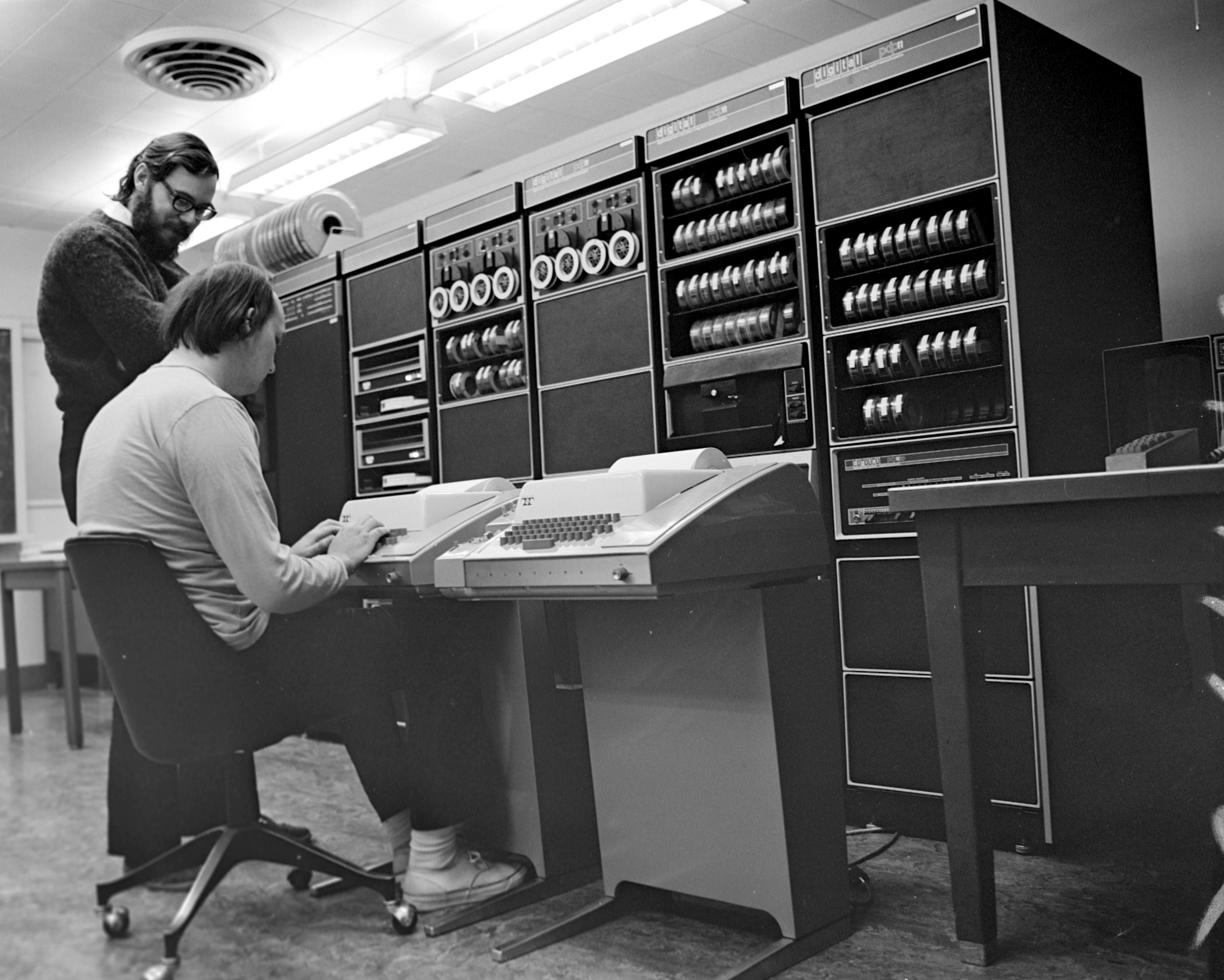 Ken Thompson and Dennis Ritchie at Bell Labs, working on a PDP-11. The birthplace of Unix and its philosophy.